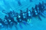 Top Stories, NRI and team break Guinness world record for the longest human chain underwater, nri and team creates guinness world record, Scuba diving